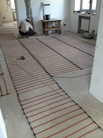 Монтаж теплых полов в загородном коттедже Монтаж теплых полов в загородном коттедже